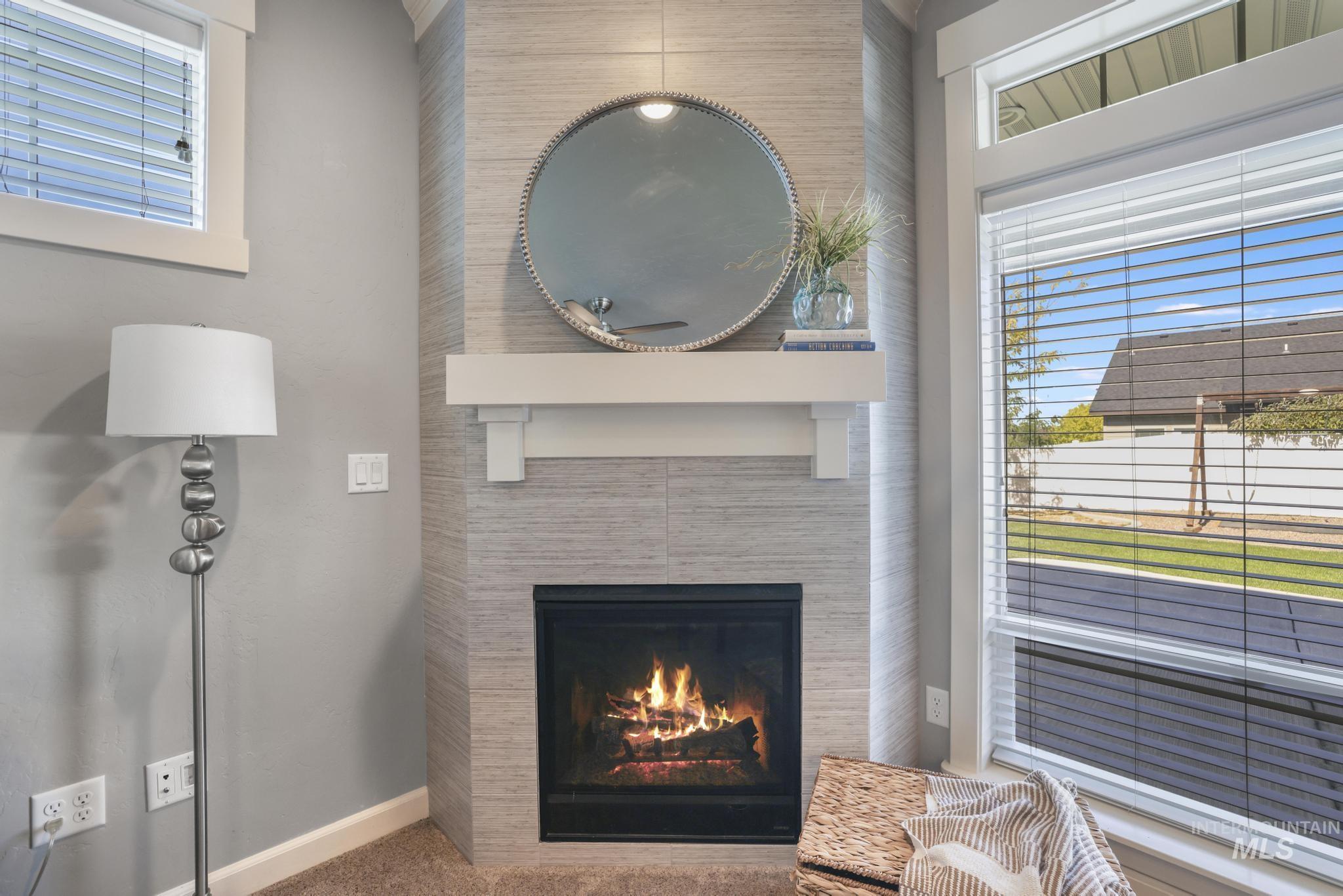 2858 Sunray Loop Twin Falls, ID 83301 - Photo 9 of 45 Detailed view of a tile fireplace and carpet floors