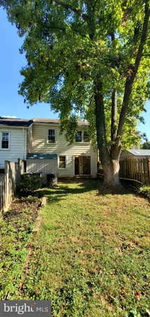 a swimming pool view with a seating space
