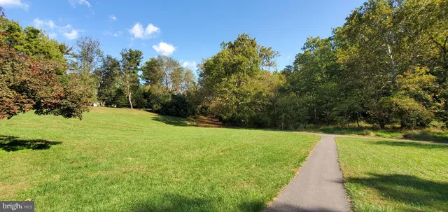 a view of a garden with swimming pool