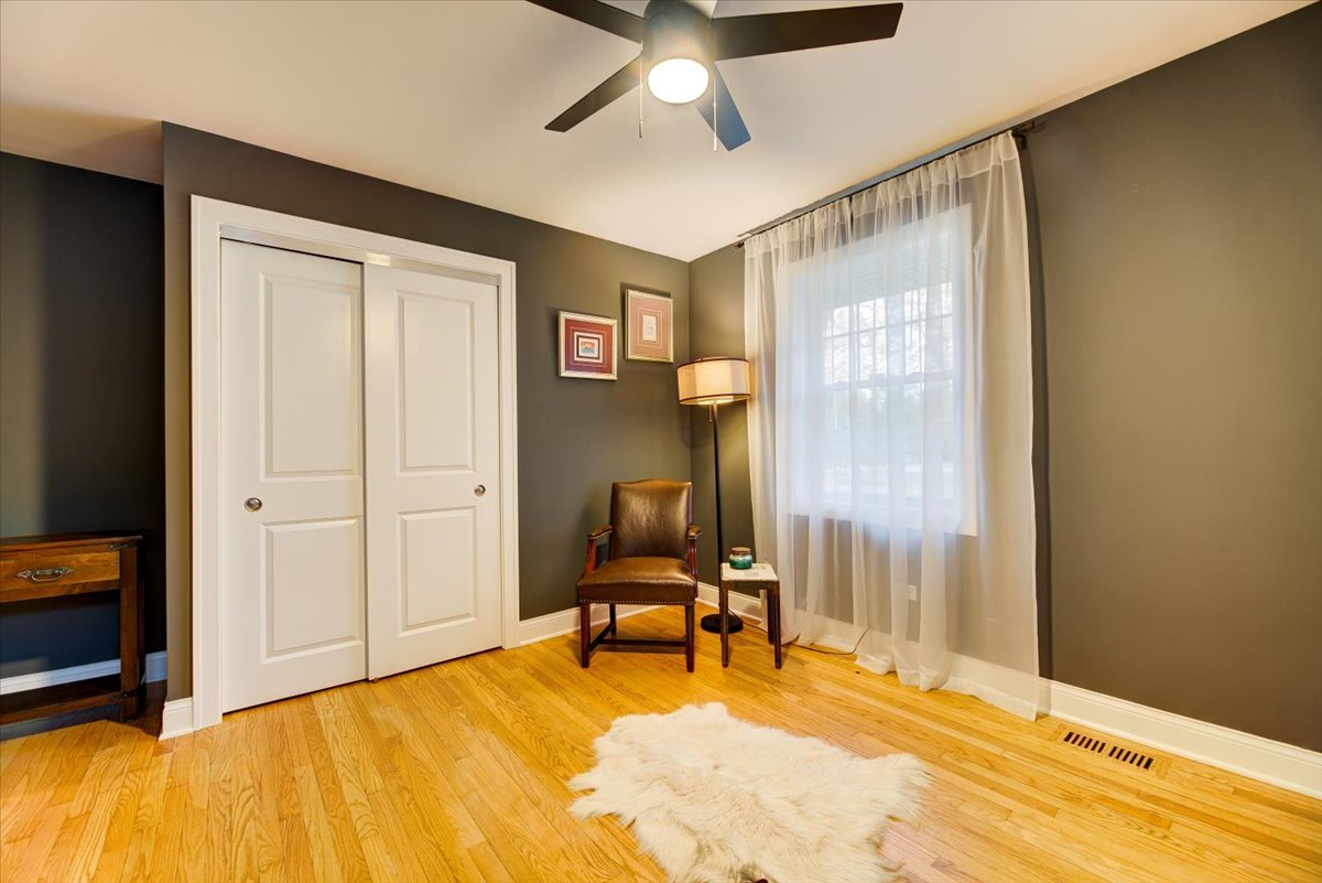 349 Deerpath Road Wood Dale, IL 60191 - Photo 23 of 43 a bedroom with a bed and a chandelier