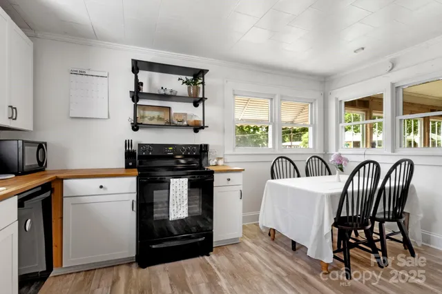 a kitchen with a stove a sink and a refrigerator