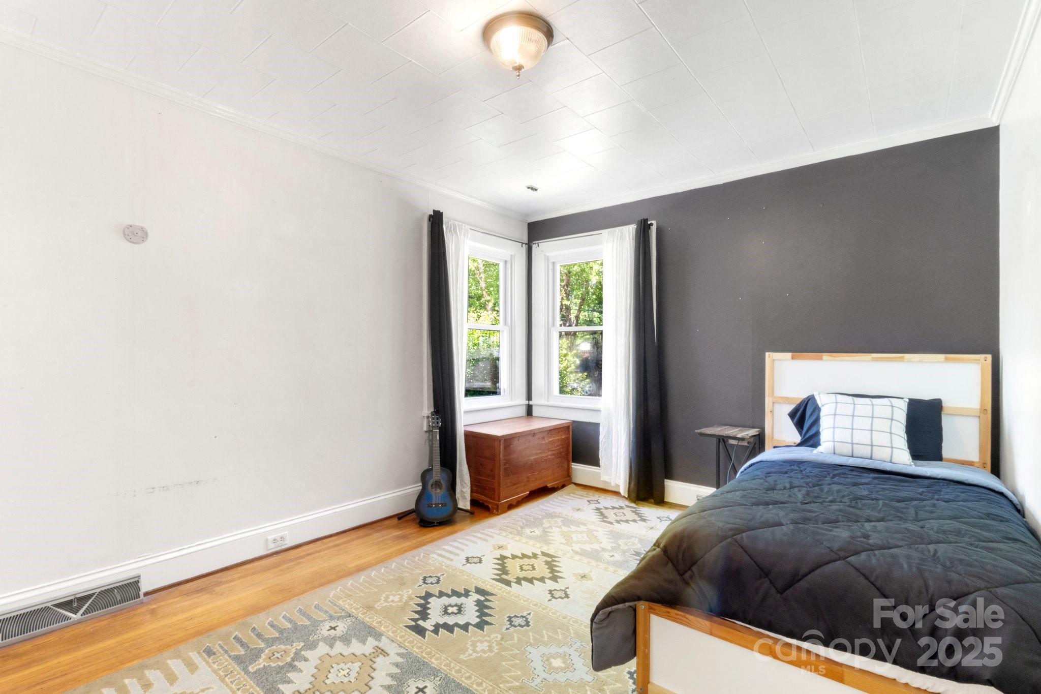 300 Cook Street Kannapolis, NC 28083 - Photo 17 of 40 a bedroom with a large bed and a window