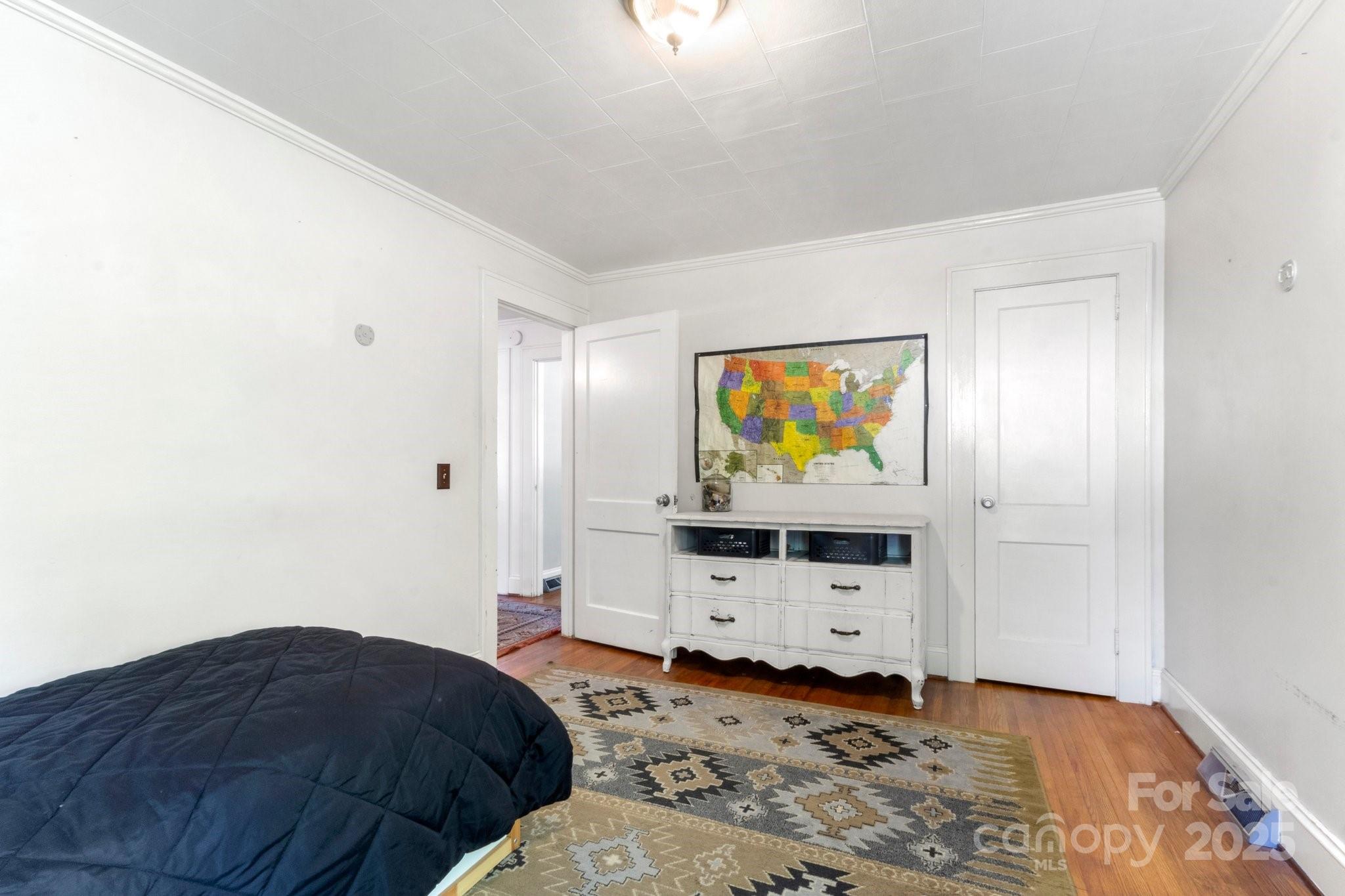300 Cook Street Kannapolis, NC 28083 - Photo 19 of 40 a bedroom with a bed and a television