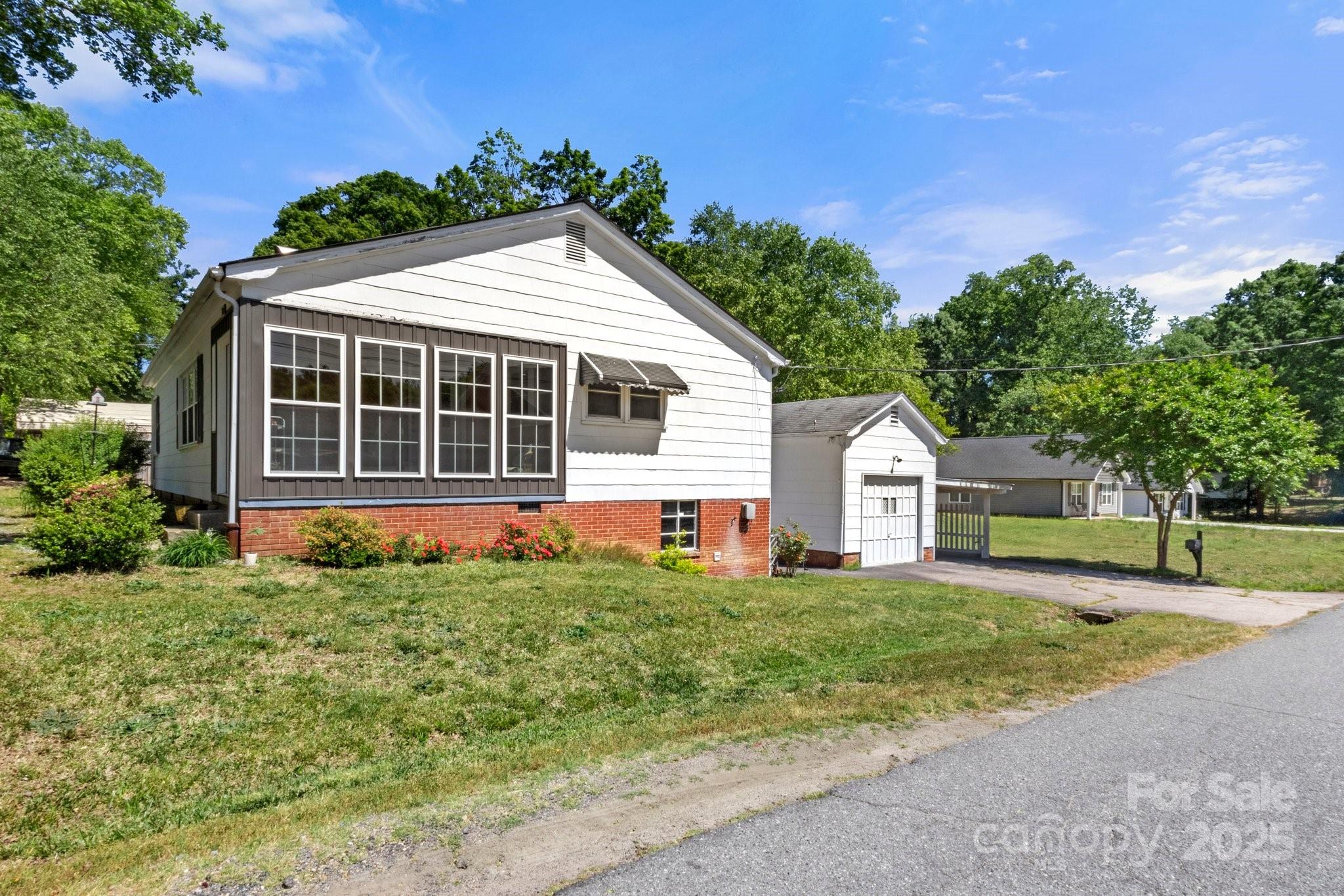 300 Cook Street Kannapolis, NC 28083 - Photo 33 of 40 a front view of a house with a yard