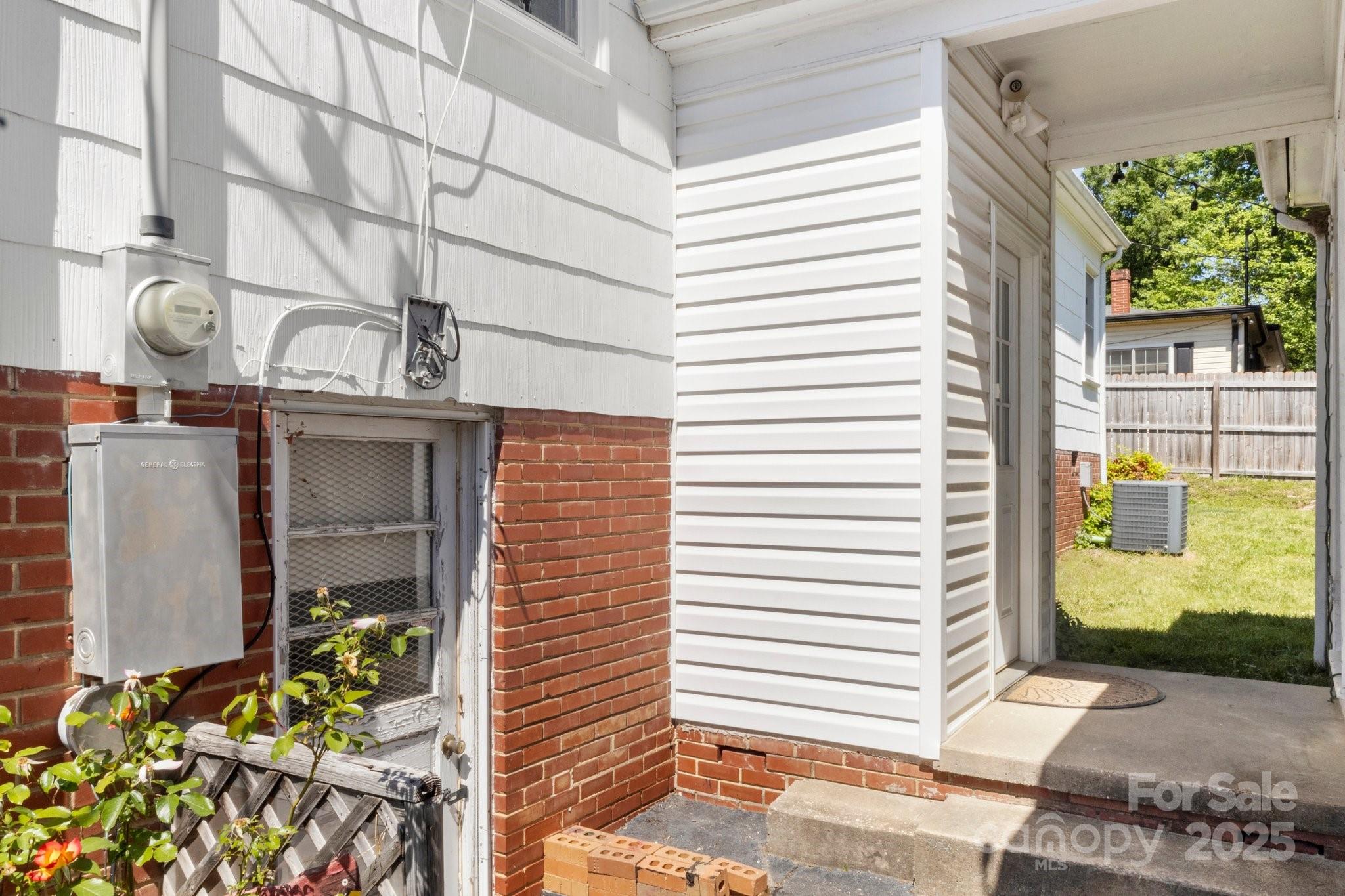 300 Cook Street Kannapolis, NC 28083 - Photo 35 of 40 a view of a door and chair in back yard of the house