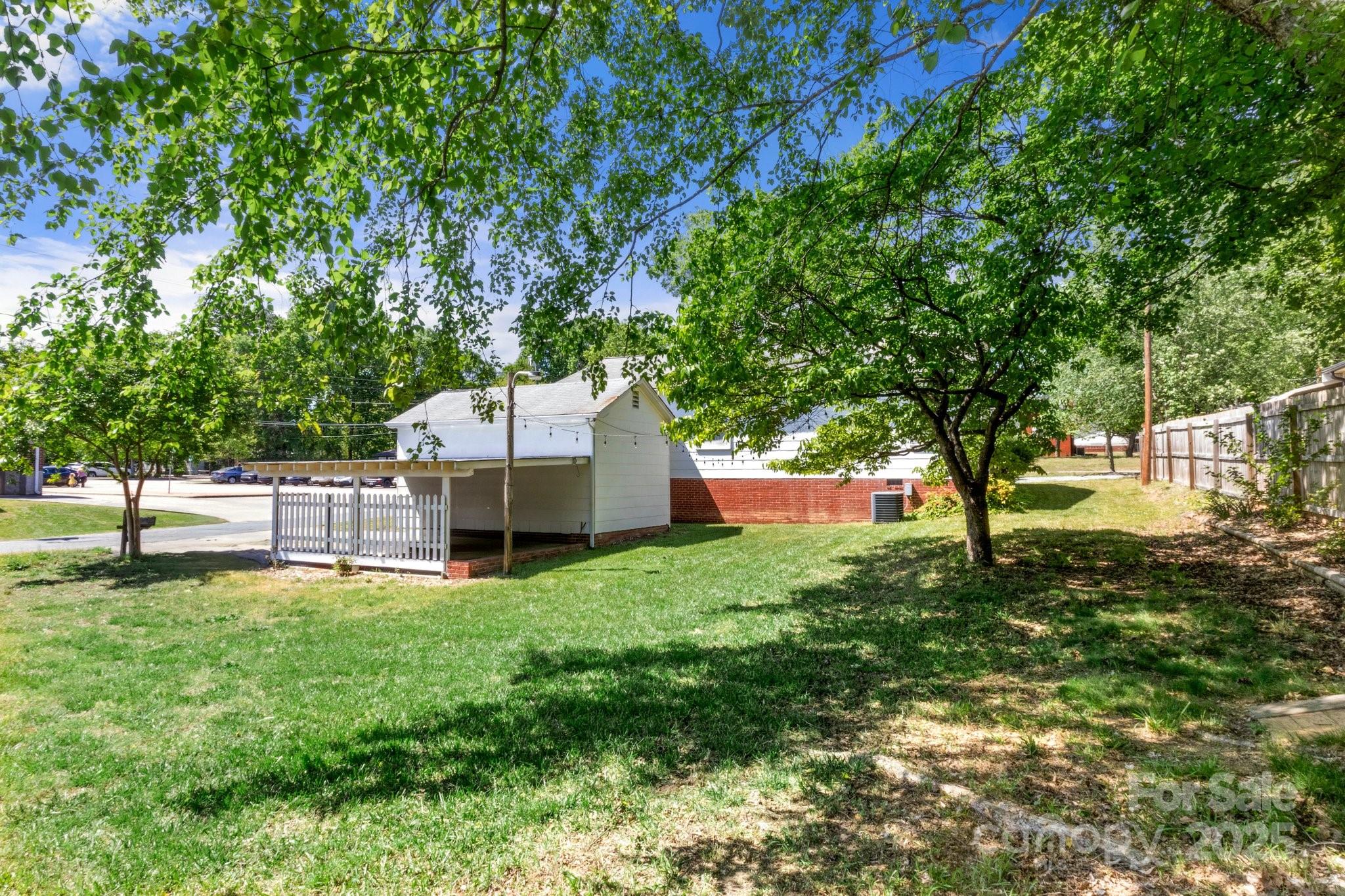 300 Cook Street Kannapolis, NC 28083 - Photo 39 of 40 a view of a backyard with a small cabin