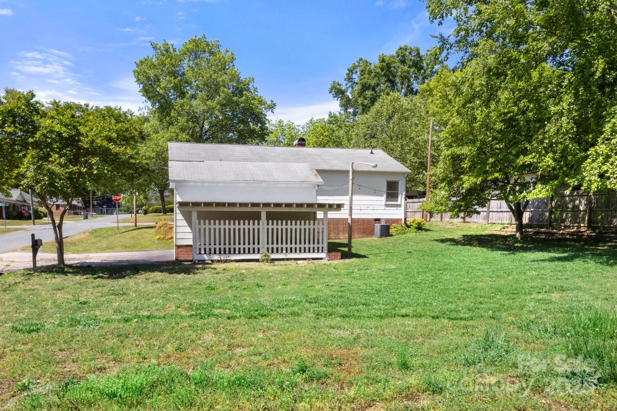 300 Cook Street Kannapolis, NC 28083 - Photo 40 of 40 a view of a house with a big yard and large trees