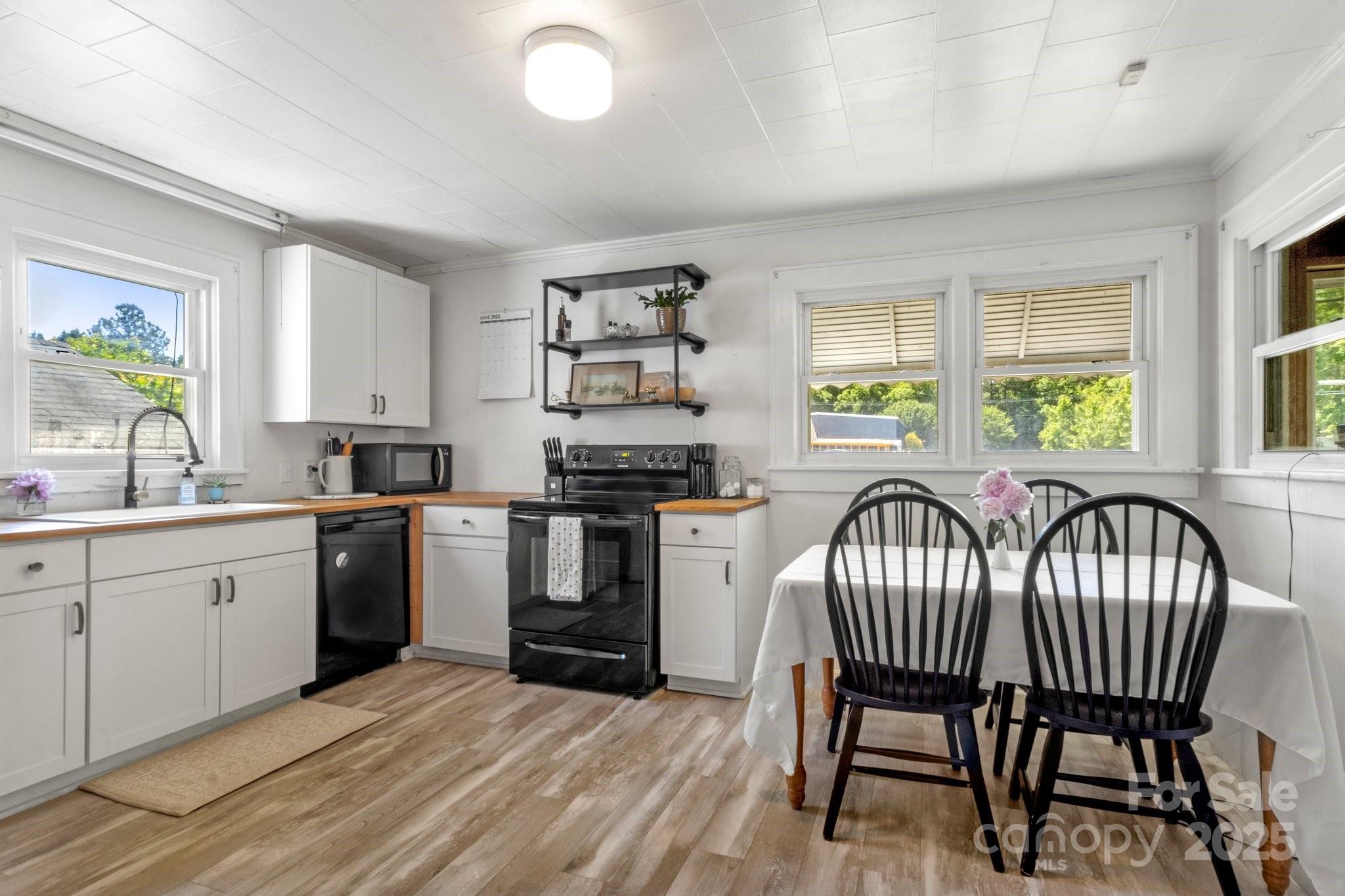 300 Cook Street Kannapolis, NC 28083 - Photo 9 of 40 a kitchen with sink cabinets and window