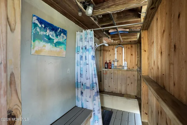 a view of hallway with wooden floor