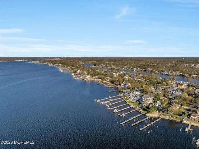 an aerial view of residential building and ocean