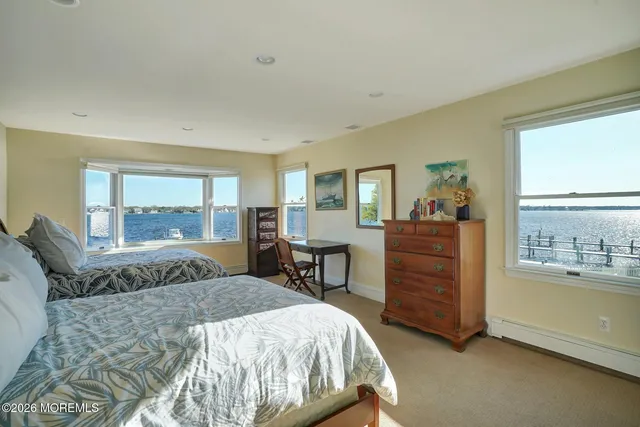 a room with chairs and pool table