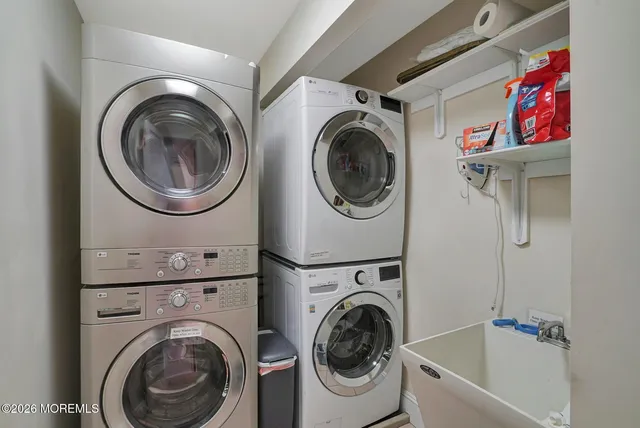 a view of a hallway with washer and dryer
