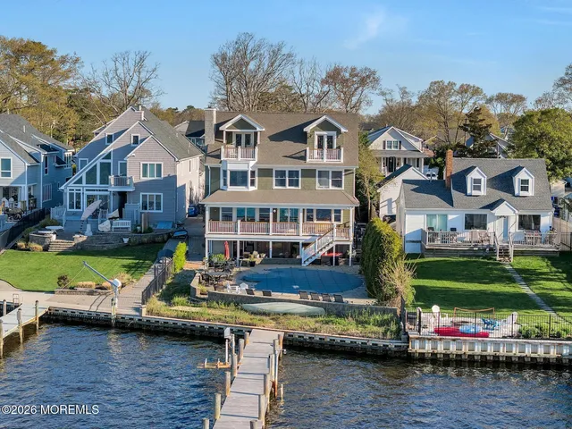 a kitchen with stainless steel appliances granite countertop wooden cabinets a stove top oven a sink and dishwasher