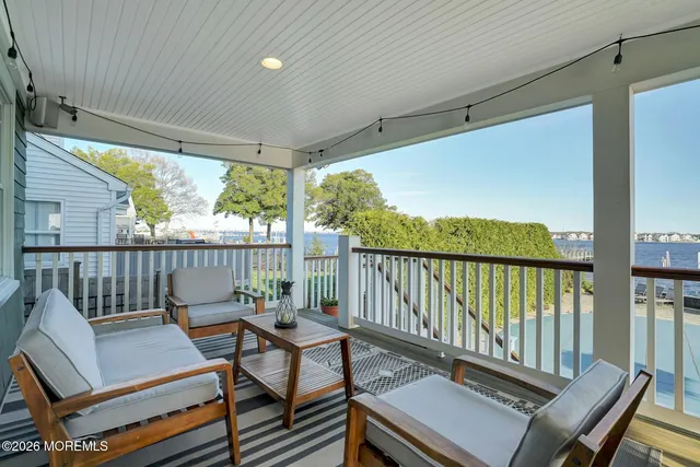 a view of a balcony with furniture