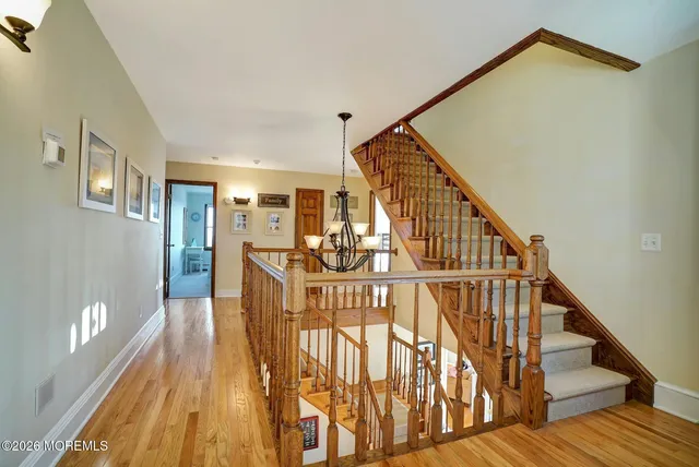 a view of an entryway with wooden floor and windows