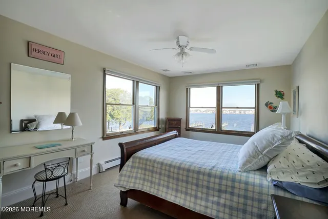 a living room with furniture and large windows