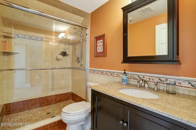 a bedroom with a bed a table and chair