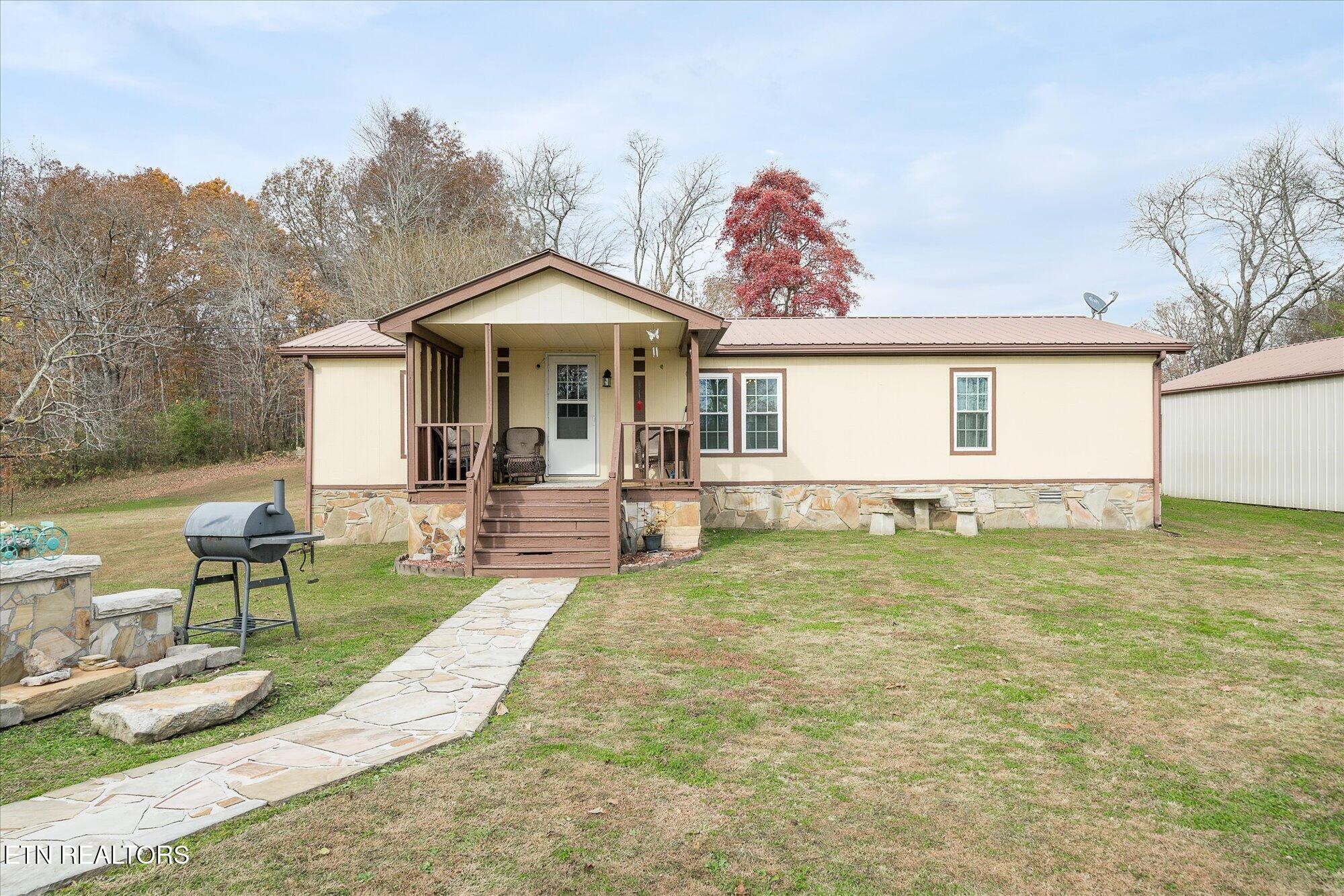 409 West Loop Road Sparta, TN 38583 - Photo 3 of 38 a view of a house with backyard porch and sitting area