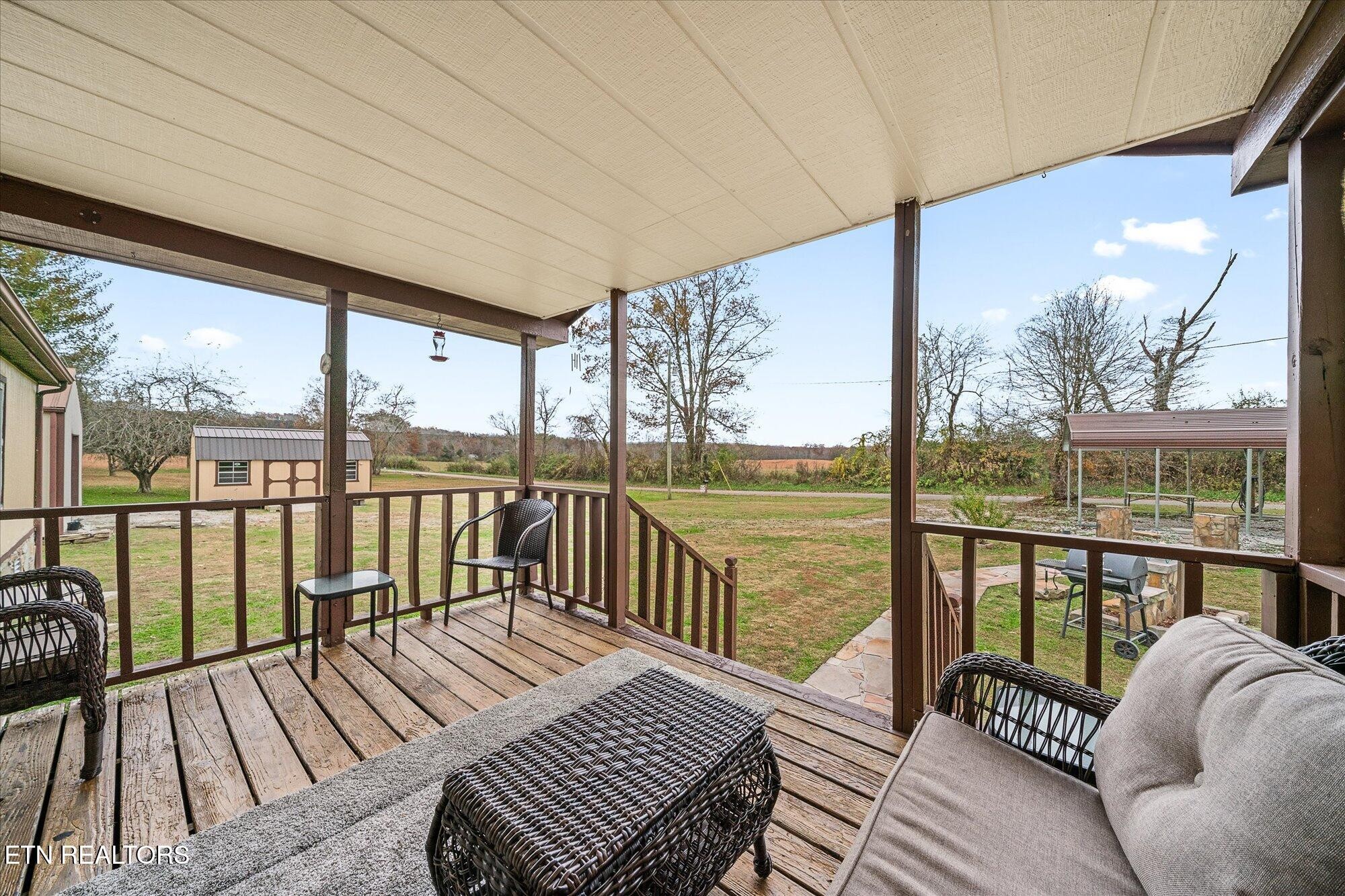 409 West Loop Road Sparta, TN 38583 - Photo 5 of 38 a balcony with wooden floor table and chairs