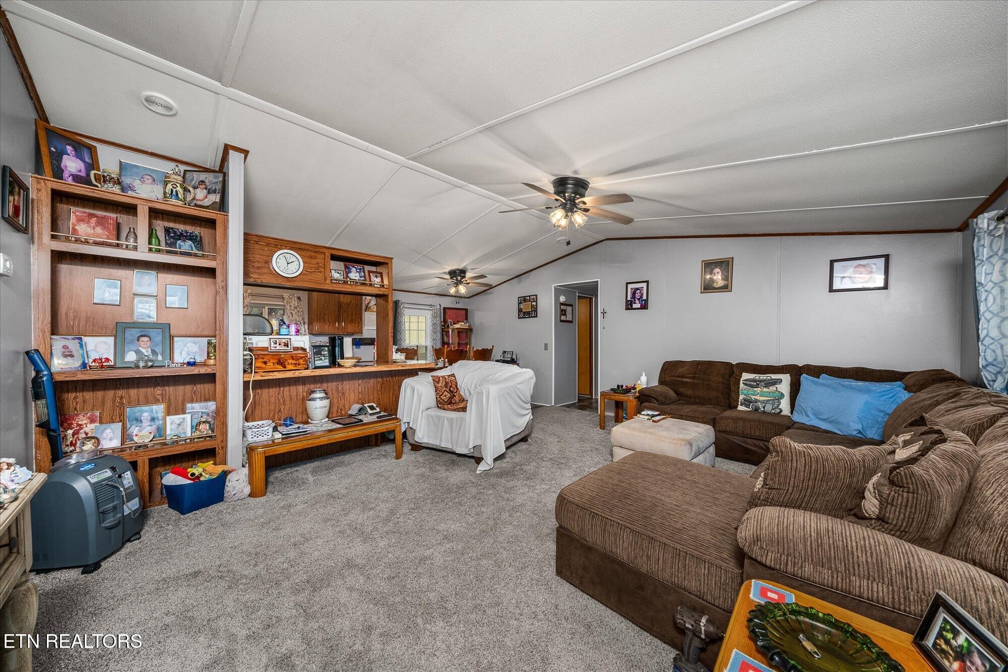 409 West Loop Road Sparta, TN 38583 - Photo 8 of 38 a living room with furniture a bookshelf and a book shelf