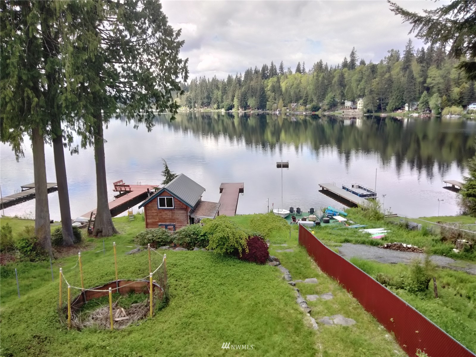 19527 Lerch Road Snohomish, WA 98290 - Photo 13 of 39 a view of a lake with a yard and a large tree