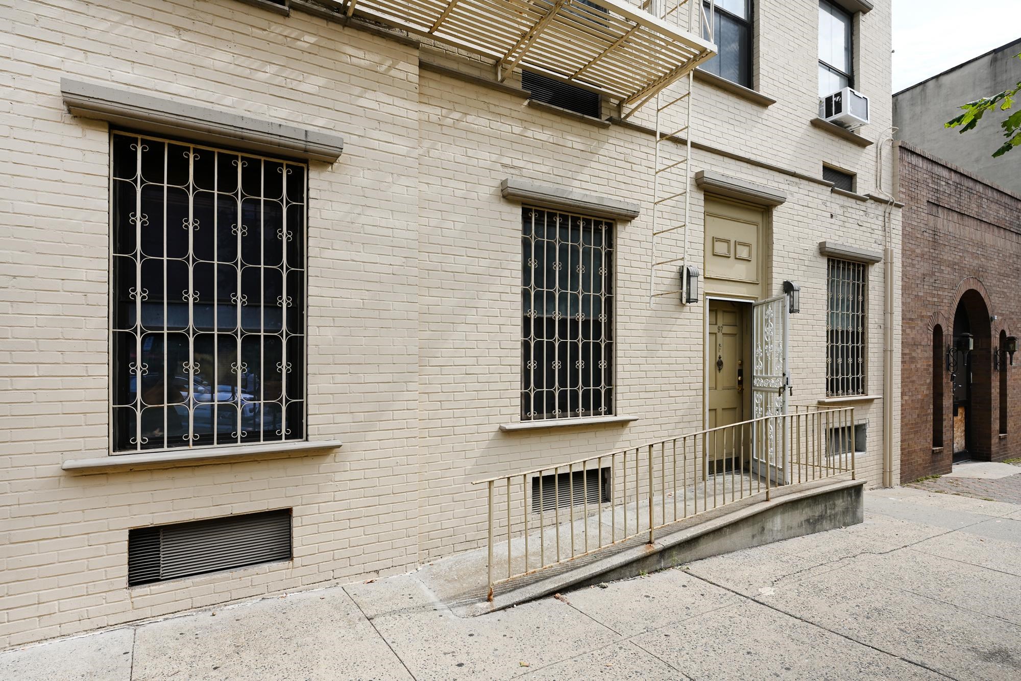 41 1st Street, Unit 1F Hoboken, NJ 07030 - Photo 2 of 8 a view of a brick house with large windows