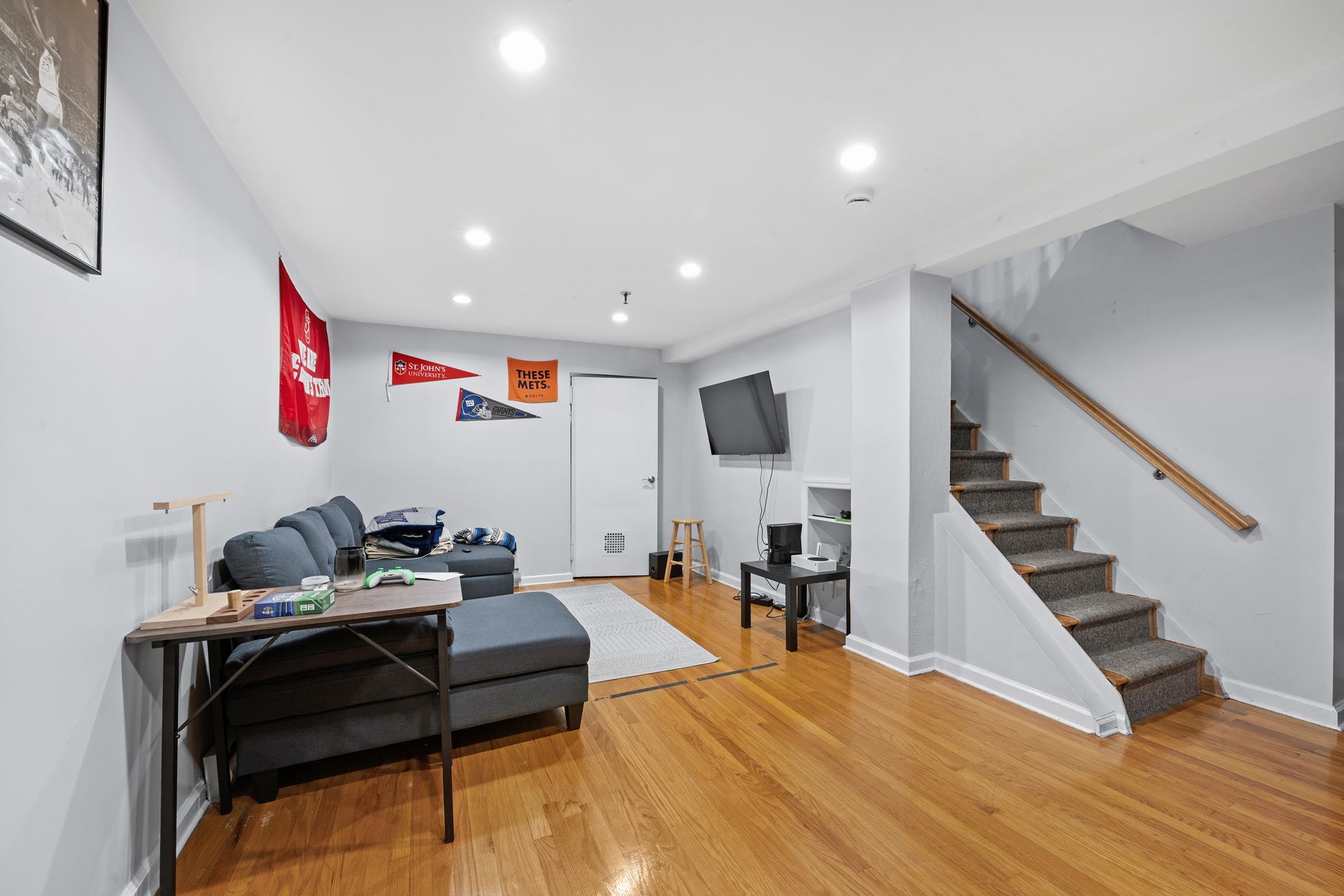 41 1st Street, Unit 1F Hoboken, NJ 07030 - Photo 7 of 8 a living room with furniture and wooden floor