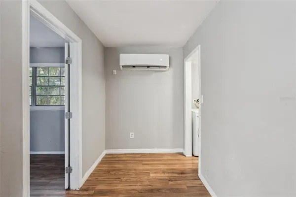 a view of a big room with closet and windows
