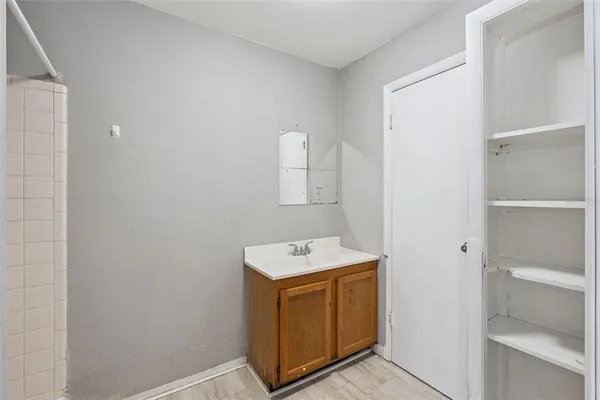 a utility room with cabinets washer and dryer