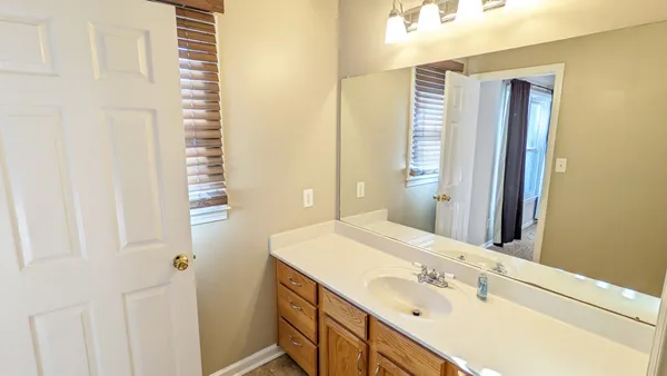 a white toilet sitting next to a shower curtain