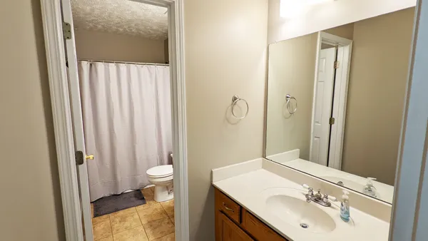 a view of a ceiling fan with wooden floor