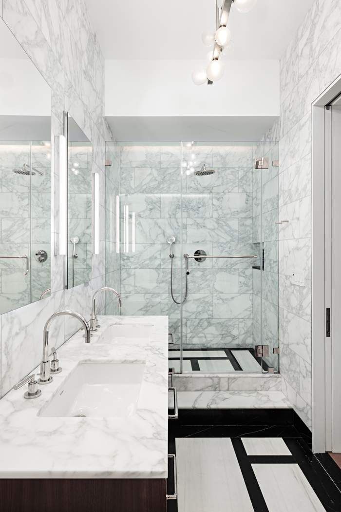 910 5th Avenue, Unit 7C Manhattan, NY 10021 - Photo 9 of 15 a bathroom with a granite countertop sink a mirror and a shower