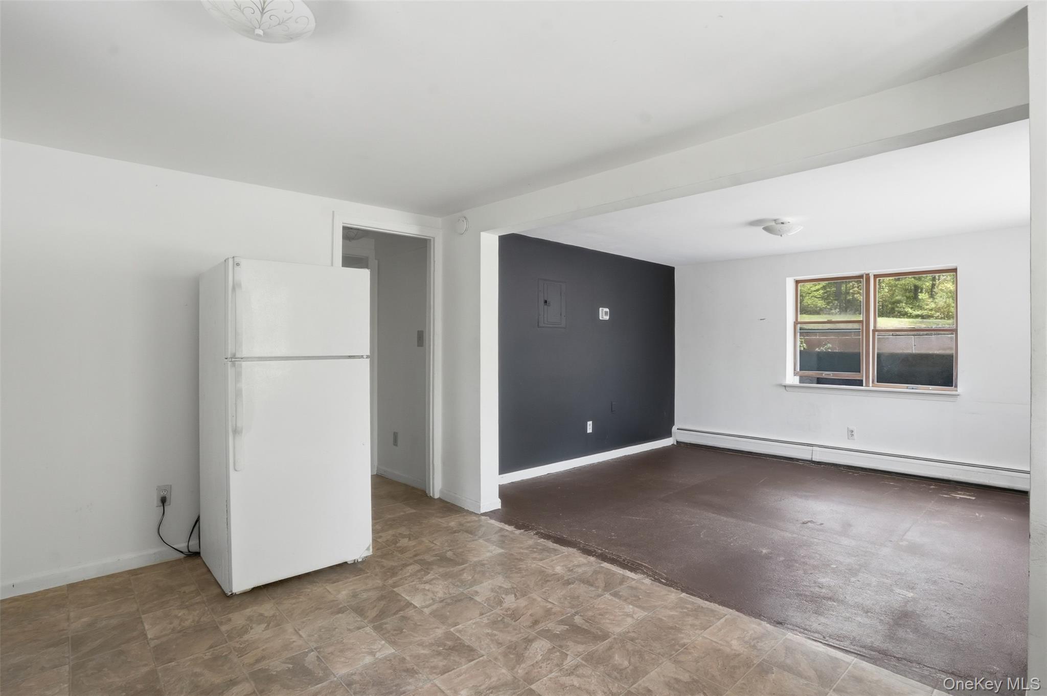 6 Short Road Wurtsboro, NY 12790 - Photo 41 of 48 an empty room with a refrigerator and microwave