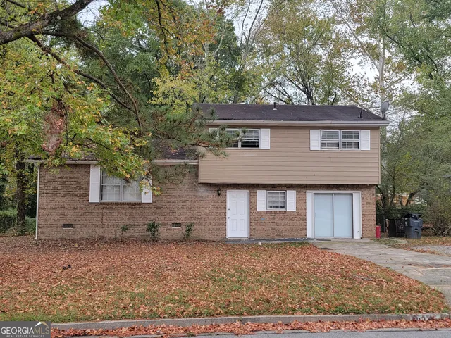 front view of a house with a dry yard