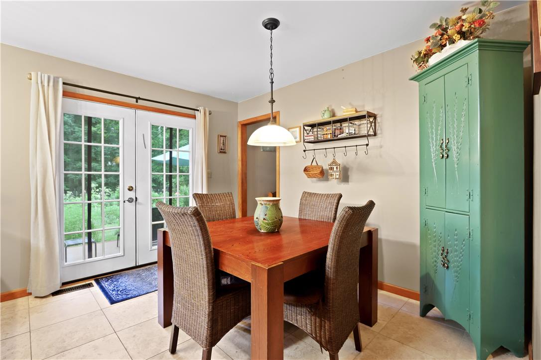 209 Remington Road East Stroudsburg, PA 18301 - Photo 17 of 41 French doors provide garden views and natural light to this charming dining area with ceramic tile flooring.