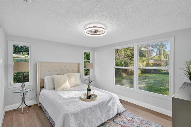 a bedroom with a bed and window