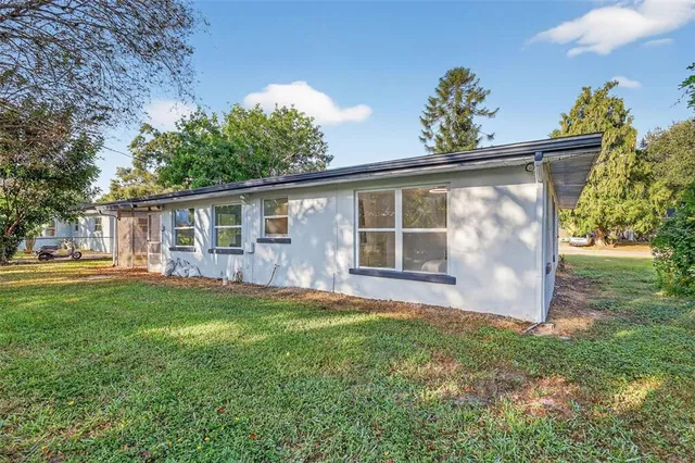 a view of outdoor space with deck and yard