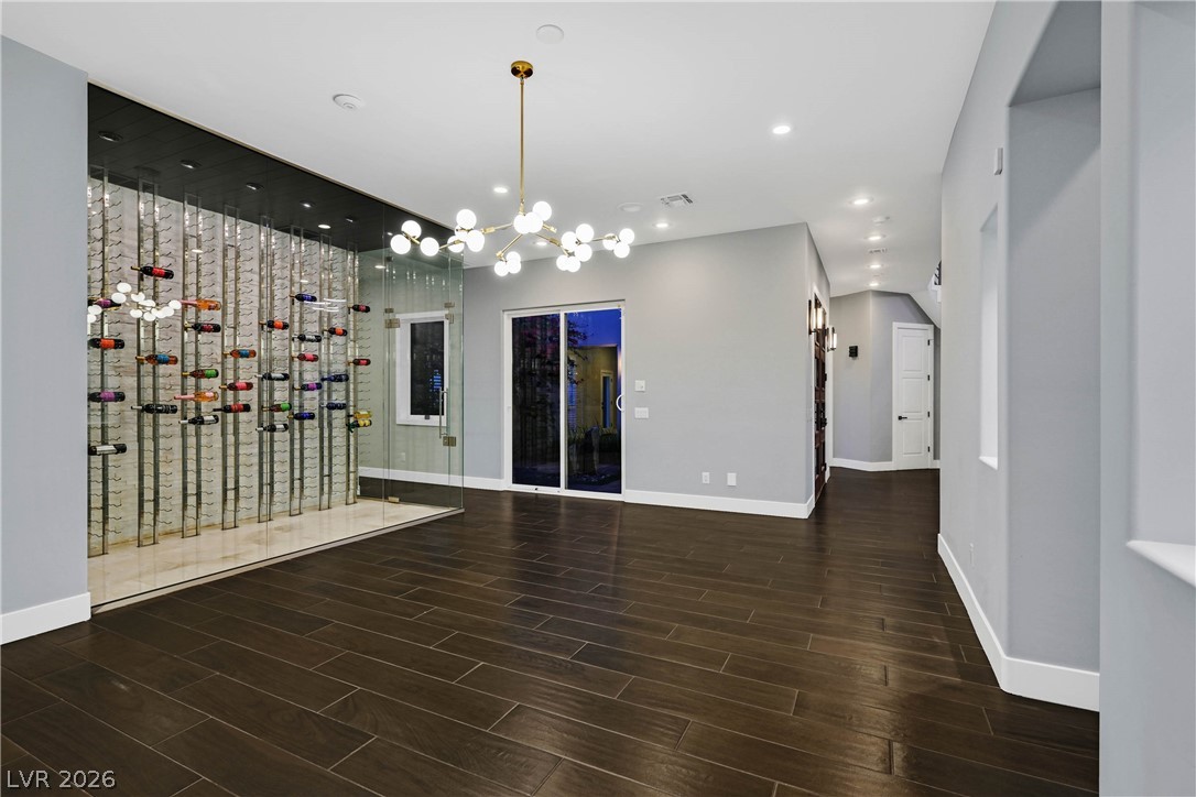 6 Rue Du Ville Henderson, NV 89011 - Photo 41 of 99 This living space features a custom wine cellar and elegant flooring, creating an ideal setting for entertaining.