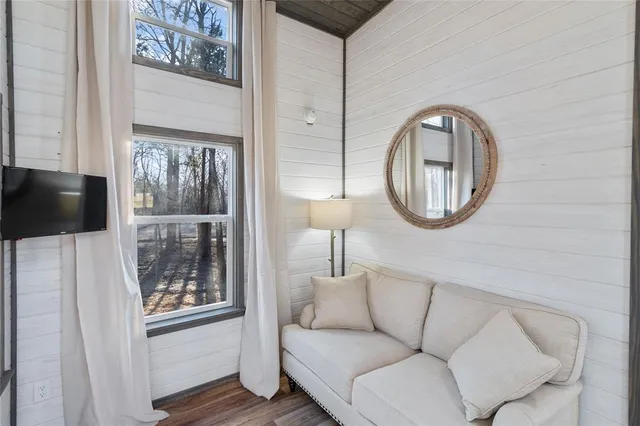 a view of a chairs and table in the balcony