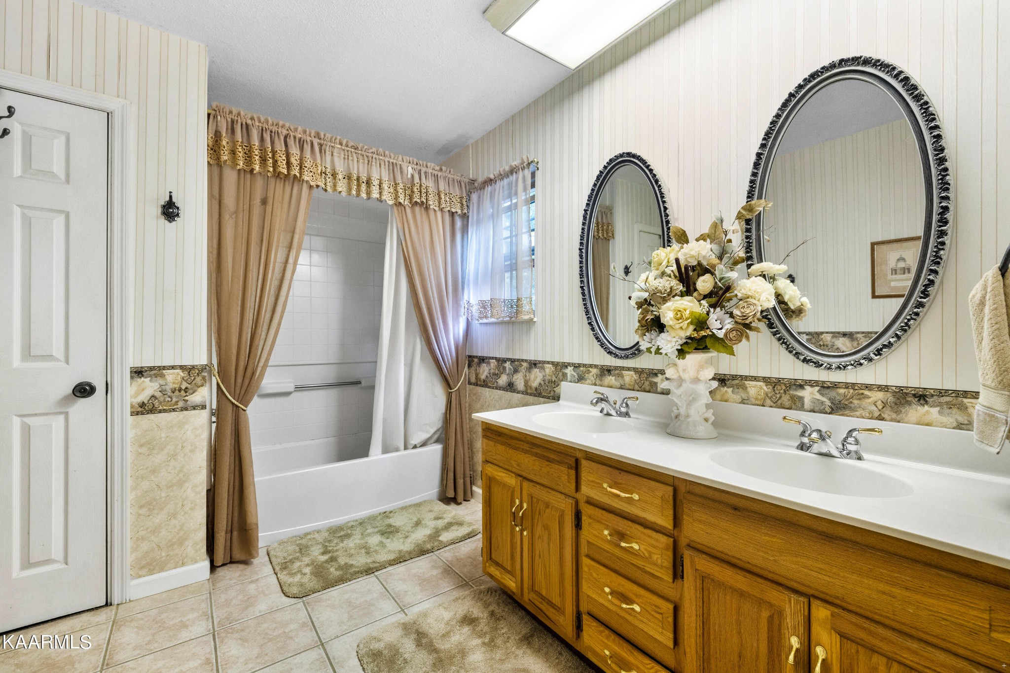 242 Mountain View Drive Rutledge, TN 37861 - Photo 17 of 28 a bathroom with a double vanity sink and a mirror