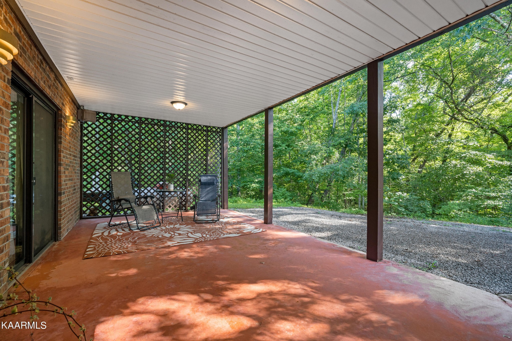 242 Mountain View Drive Rutledge, TN 37861 - Photo 25 of 28 a view of a patio with table and chairs floor to ceiling window with wooden fence