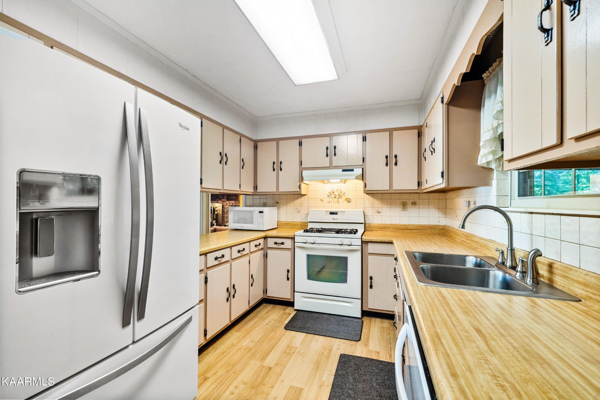 242 Mountain View Drive Rutledge, TN 37861 - Photo 6 of 28 a kitchen with stainless steel appliances granite countertop a sink stove and refrigerator