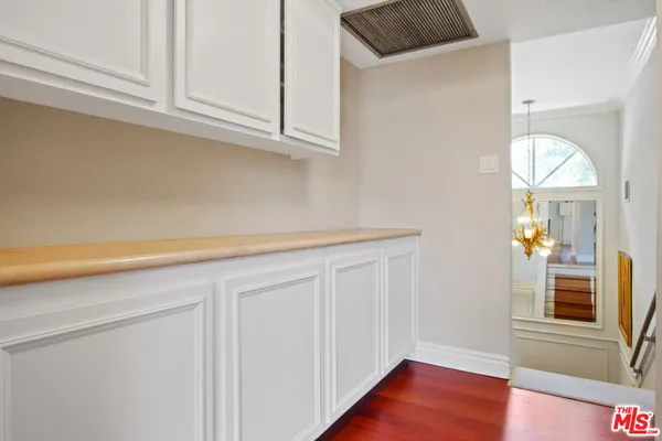 a view of a kitchen cabinets and wooden floor