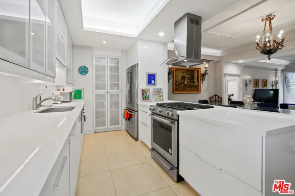 a kitchen with a stove and a refrigerator