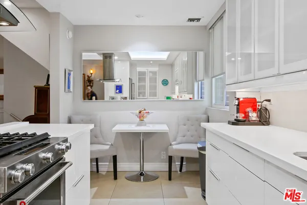 a room that has a sink and a stove in it