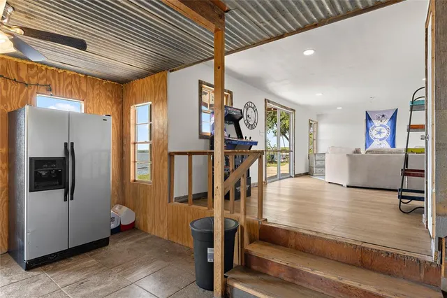 a view of a livingroom with furniture and staircase