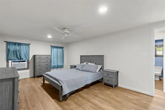 a bedroom with a bed and furniture