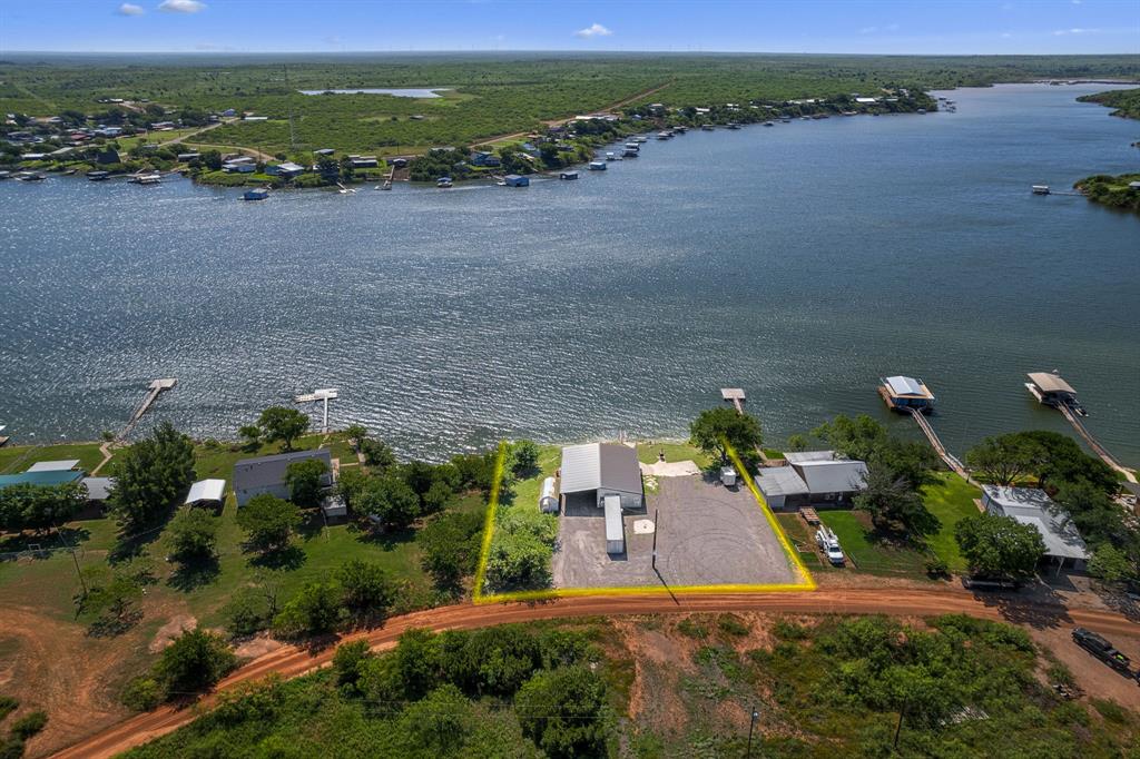 894 West Moonshine Road Seymour, TX 76380 - Photo 5 of 23 an aerial view of a house with a lake view