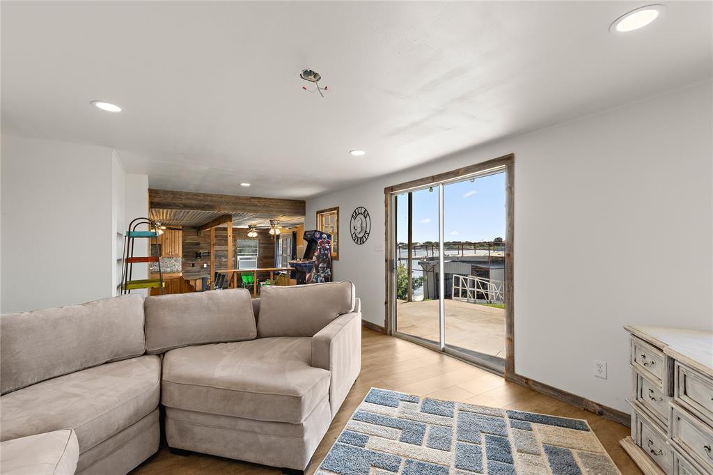 894 West Moonshine Road Seymour, TX 76380 - Photo 9 of 23 a living room with furniture and a glass door