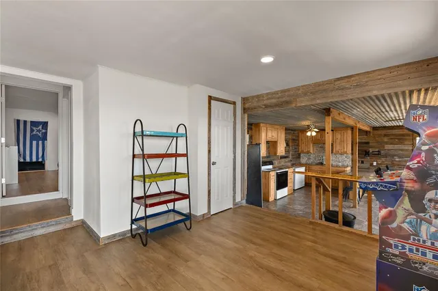 a view of a livingroom with furniture and an empty room